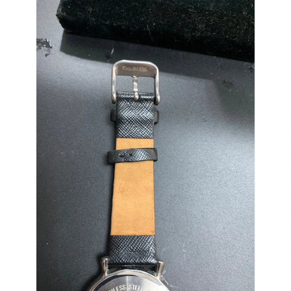 Anne Klein AK/1155 Crystal Bezel Black Dial Leather Strap Watch Womens